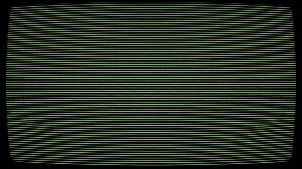 A digital texture displaying subtle, horizontal analog tracking lines with minor warping, resembling a distressed VHS tape or CRT monitor display.