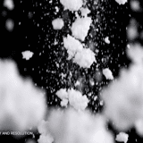 Snowfall overlay — chunky fluffy snow clumps and heavy wet snowflakes falling on black background