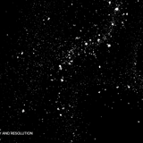 Dense monochromatic scattering of fine white dust-like particles resembling film grain