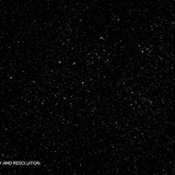 Countless tiny sparkling white stars scattered across a pure black background