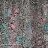 Rough grey concrete wall texture covered in heavy grunge, dirt, and peeling neon pink and teal spray paint.