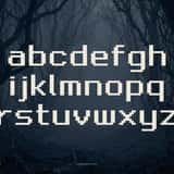 Questbit pixel RPG font, full lowercase alphabet on a forest background