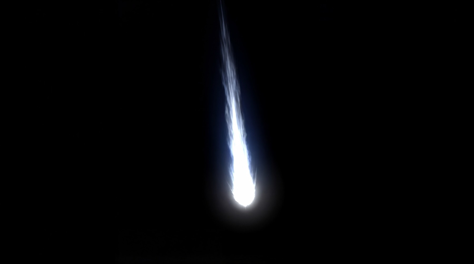 A single bright meteor streaking downwards against a black background, leaving a long, luminous blue-white trail.