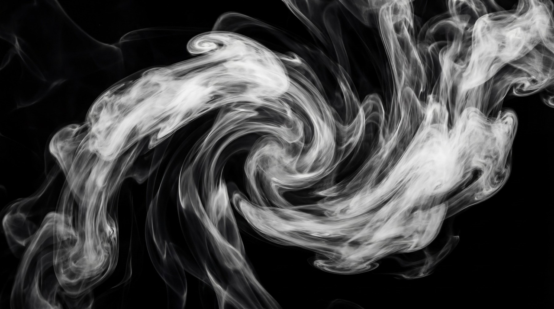 A dynamic vortex of white smoke swirling against a black background, creating a sense of movement and depth.