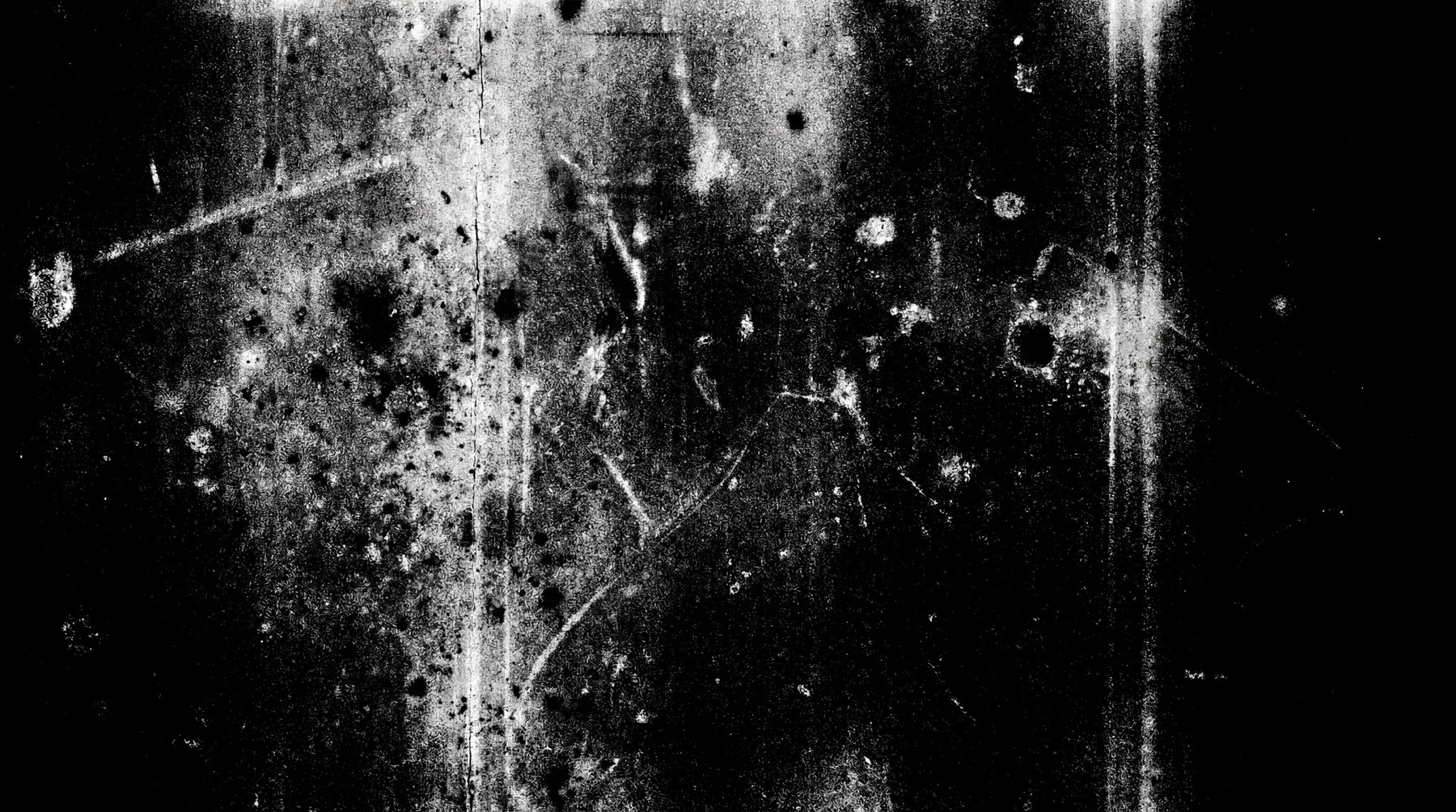 A black and white texture overlay featuring dense white dust particles, numerous scratches, and some circular blotches, resembling aged analog film.
