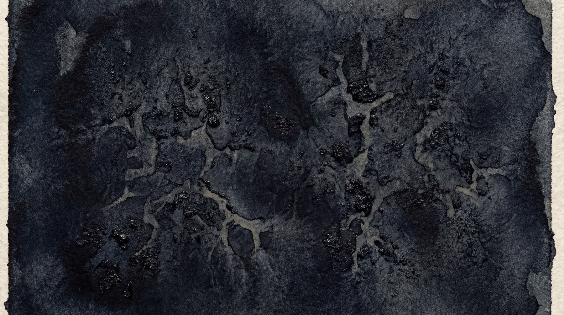 Abstract dark ink wash texture with raised, cracked surface detail.