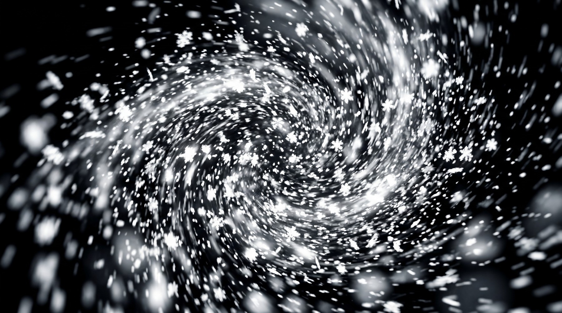 Dynamic swirling snowfall with distinct snowflake shapes against a black background.