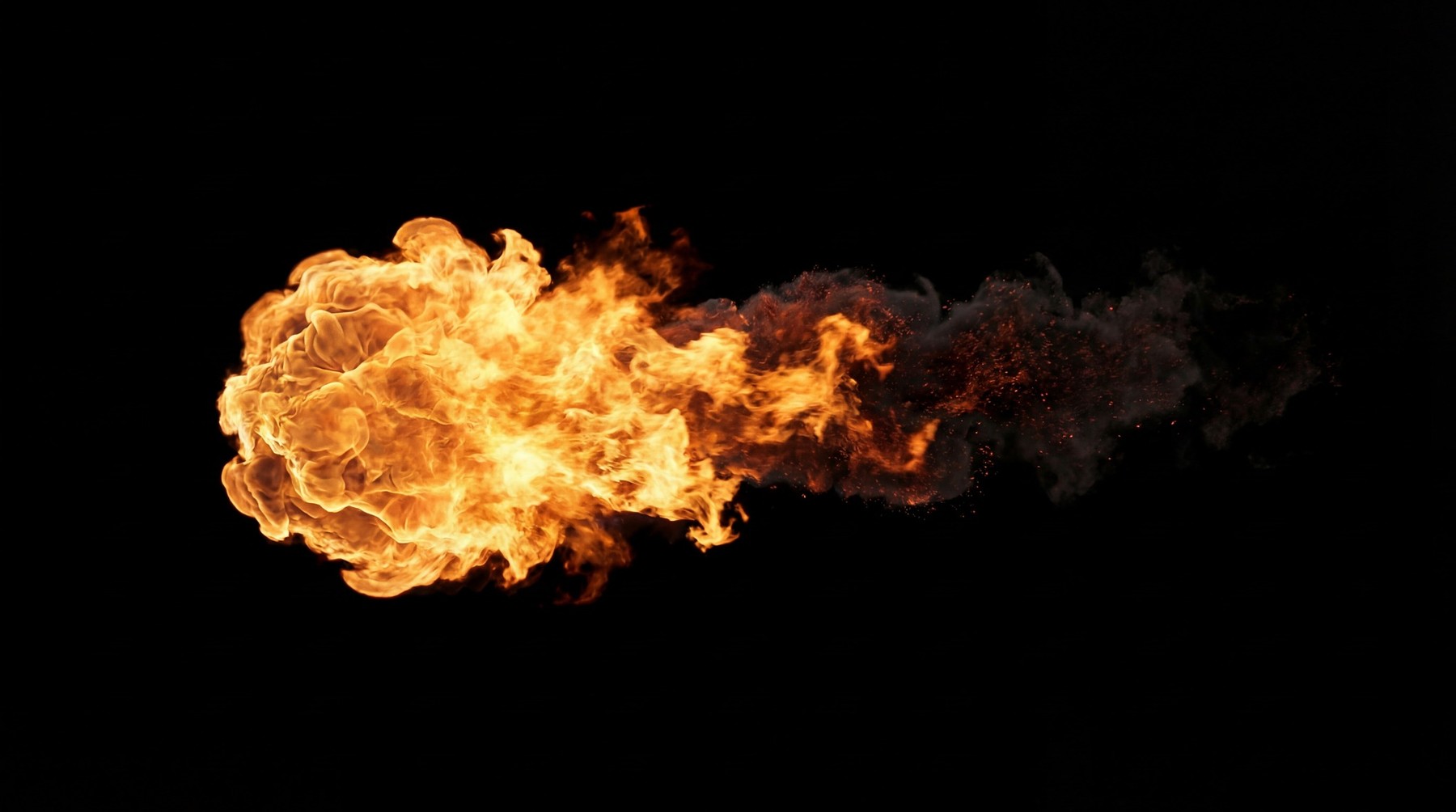 A single, intense fireball emanating from the left, transitioning into a dense trail of dark smoke and embers, against a black background.