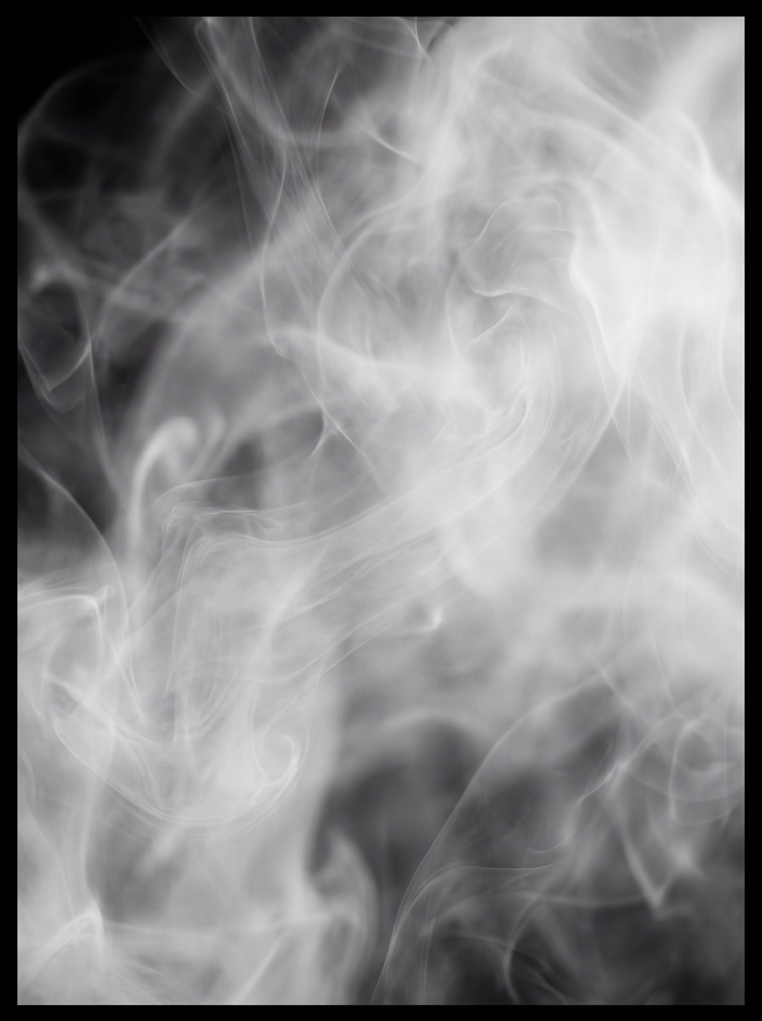 Abstract swirling wisps of white smoke against a dark background.