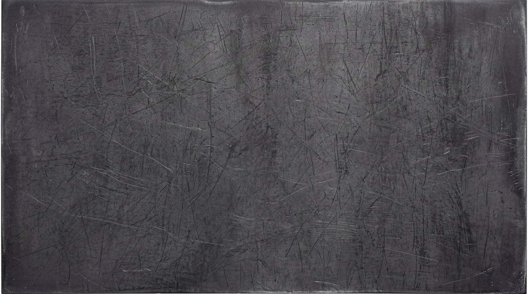 A dark, raw steel surface featuring heavy linear scratches and industrial wear across the entire metallic texture.