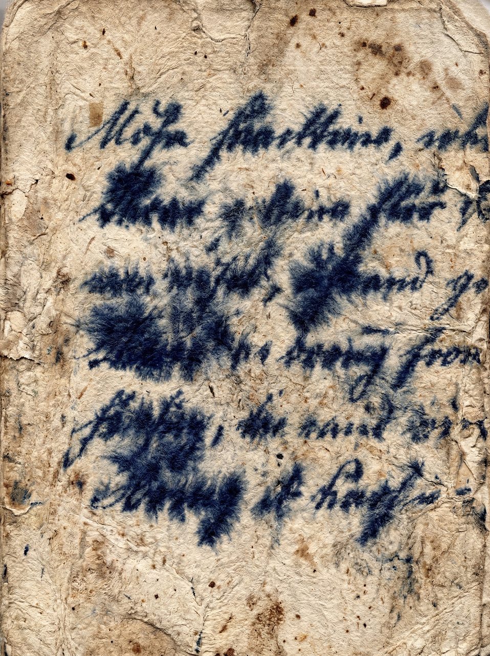 A textured background of aged, yellowed paper with dark blue ink splatters and faded handwriting.